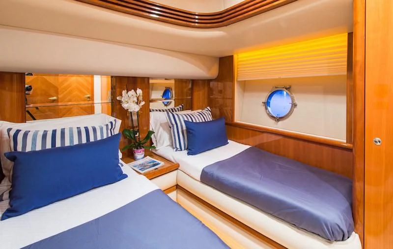 a room with two beds aboard MANU Yacht for Charter