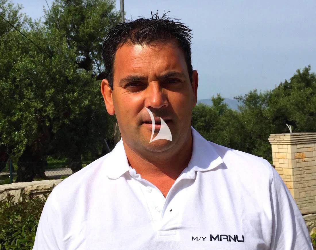 a man with his mouth open aboard MANU Yacht for Charter