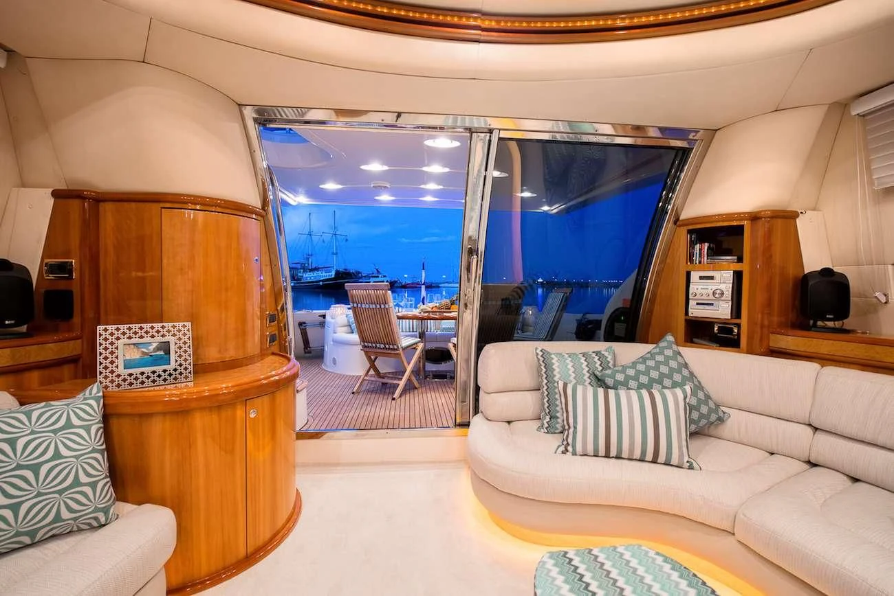 a living room with a large mirror aboard MANU Yacht for Charter