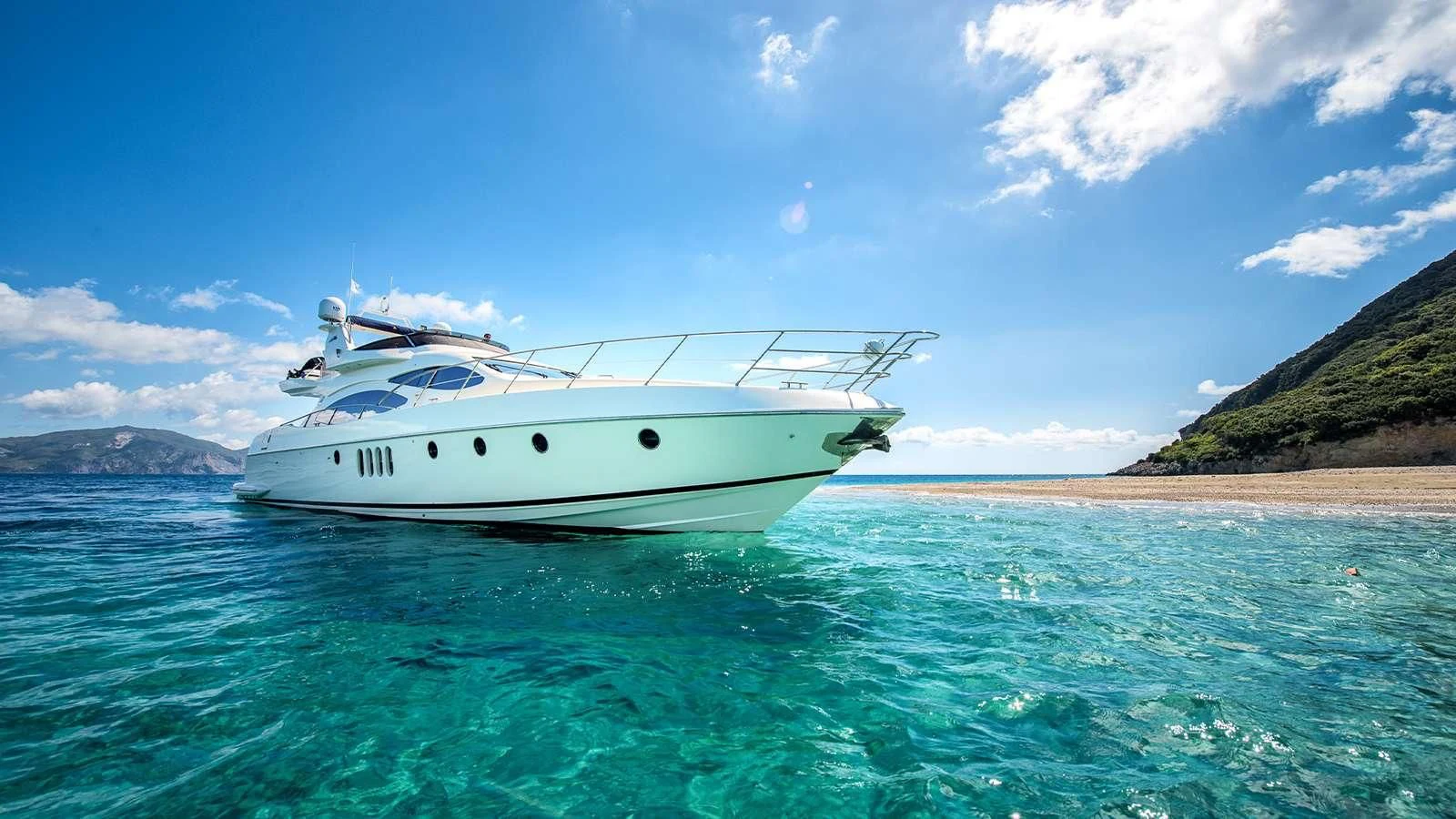a white boat in the water aboard MANU Yacht for Charter