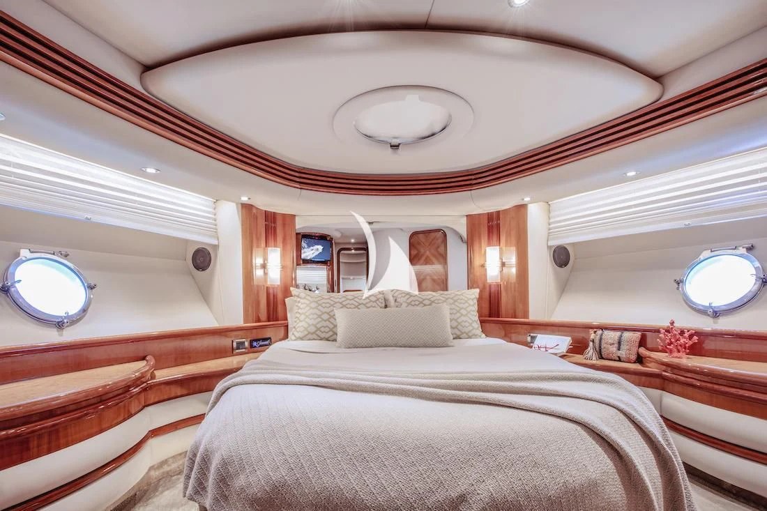 a room with a bed and a window aboard MANU Yacht for Charter