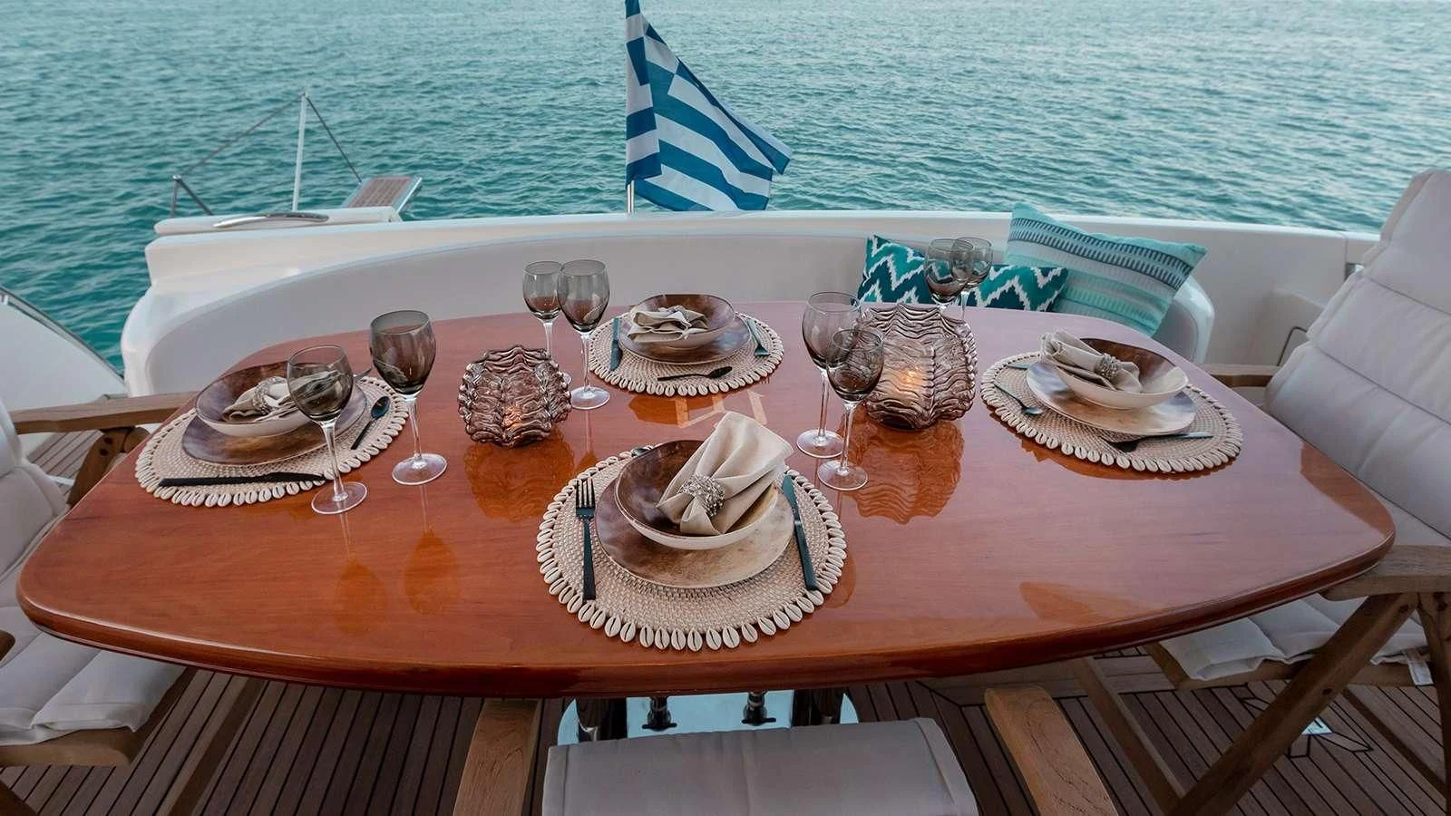 a table with food and drinks on it aboard MANU Yacht for Charter