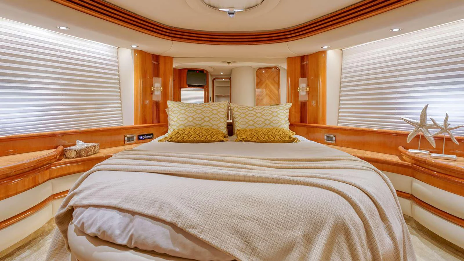 a room with a bed and a window aboard MANU Yacht for Charter