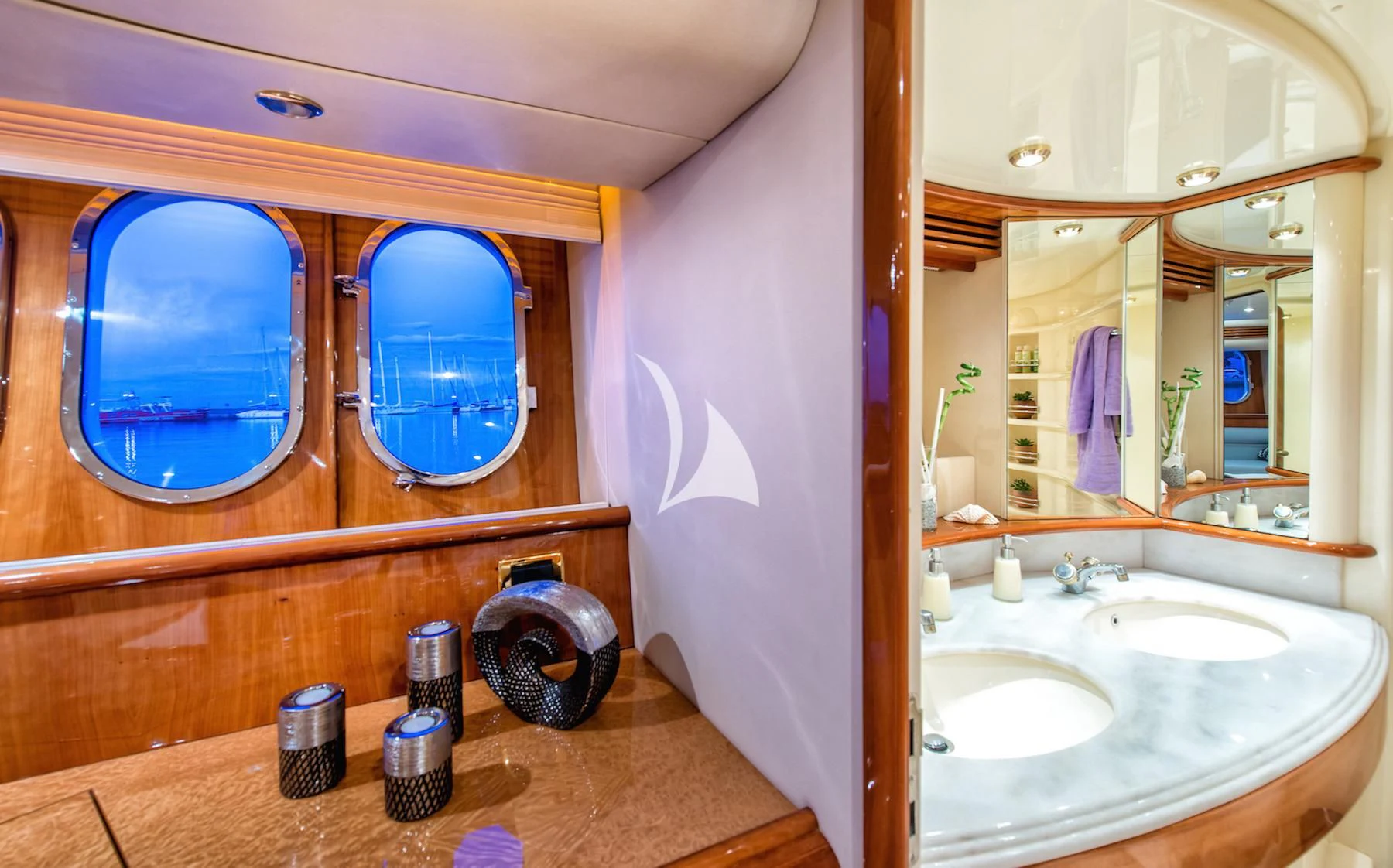 a bathroom with a sink and a mirror aboard MANU Yacht for Charter
