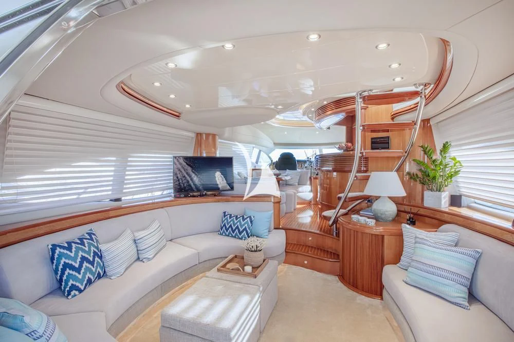 a room with a bed and a television aboard MANU Yacht for Charter