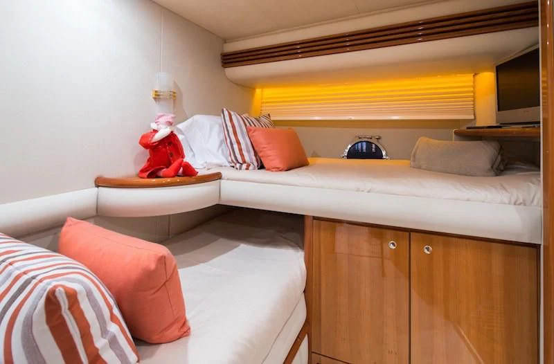 a bedroom with a bed and a desk aboard MANU Yacht for Charter