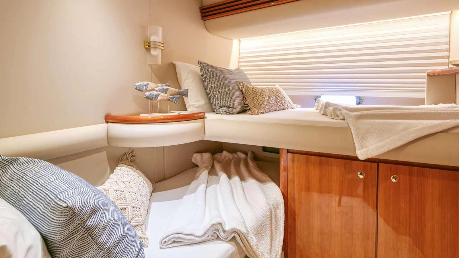 a room with a bed and a table aboard MANU Yacht for Charter