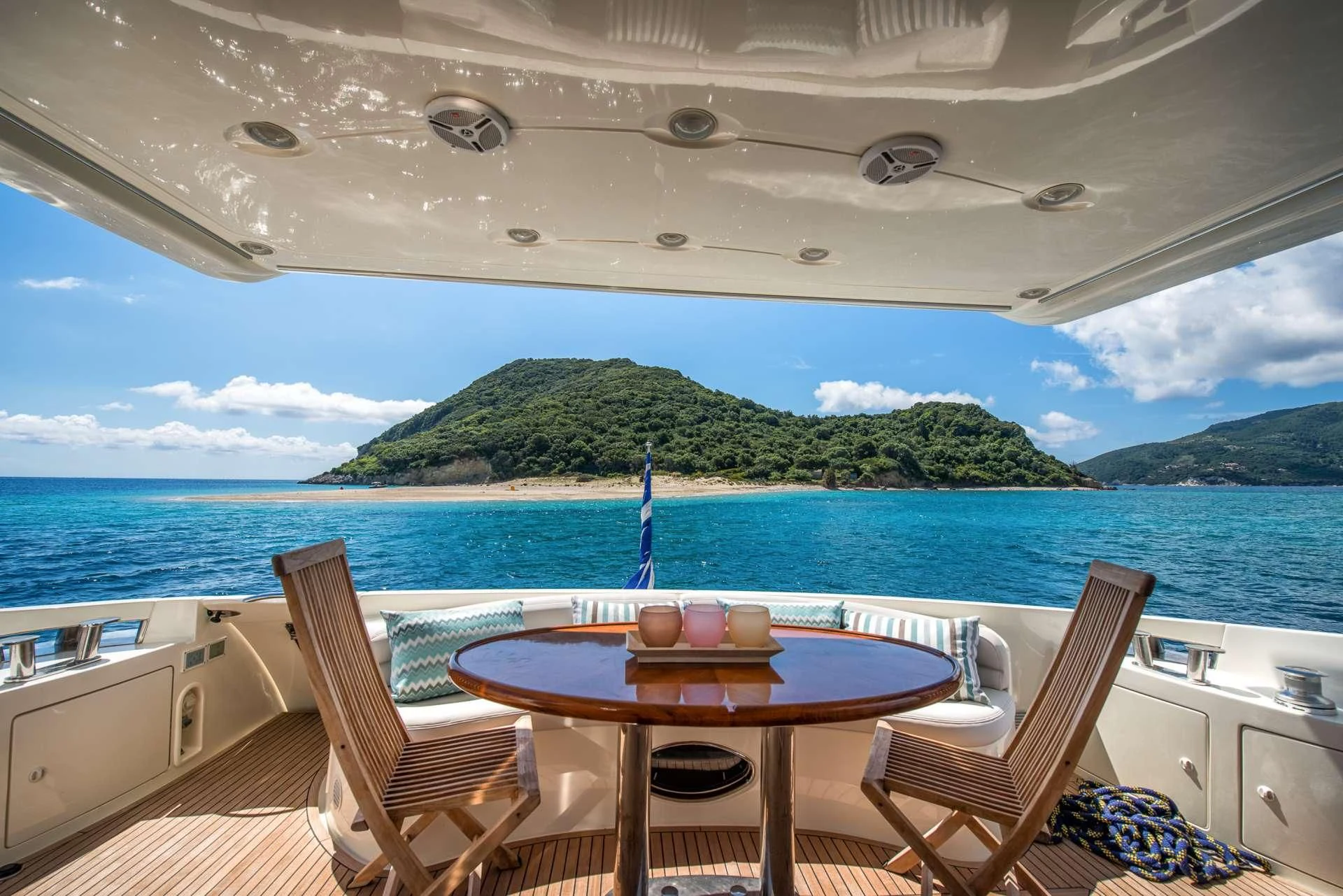 a table and chairs on a boat aboard MANU Yacht for Charter