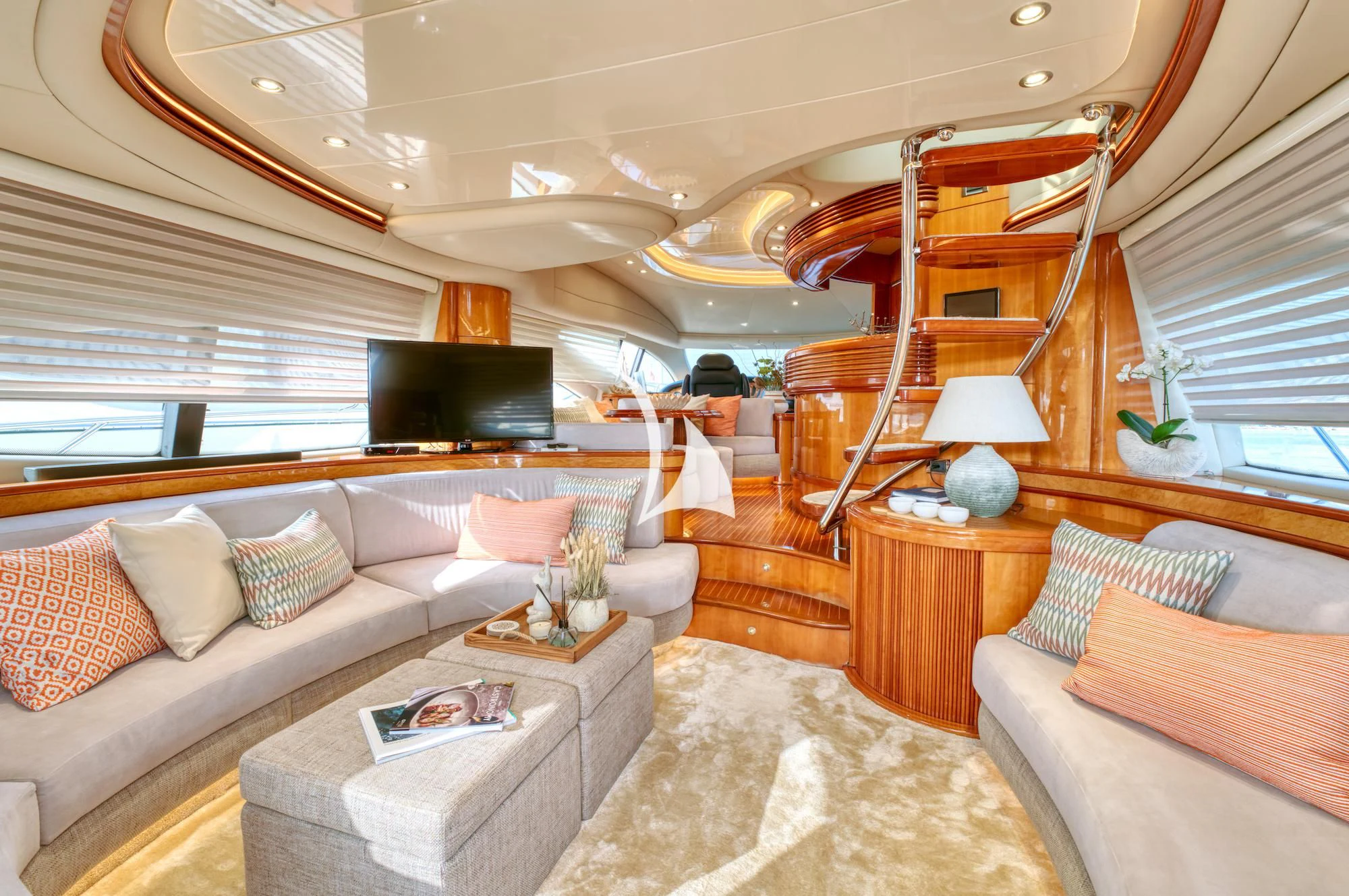 a living room with a large bed aboard MANU Yacht for Charter