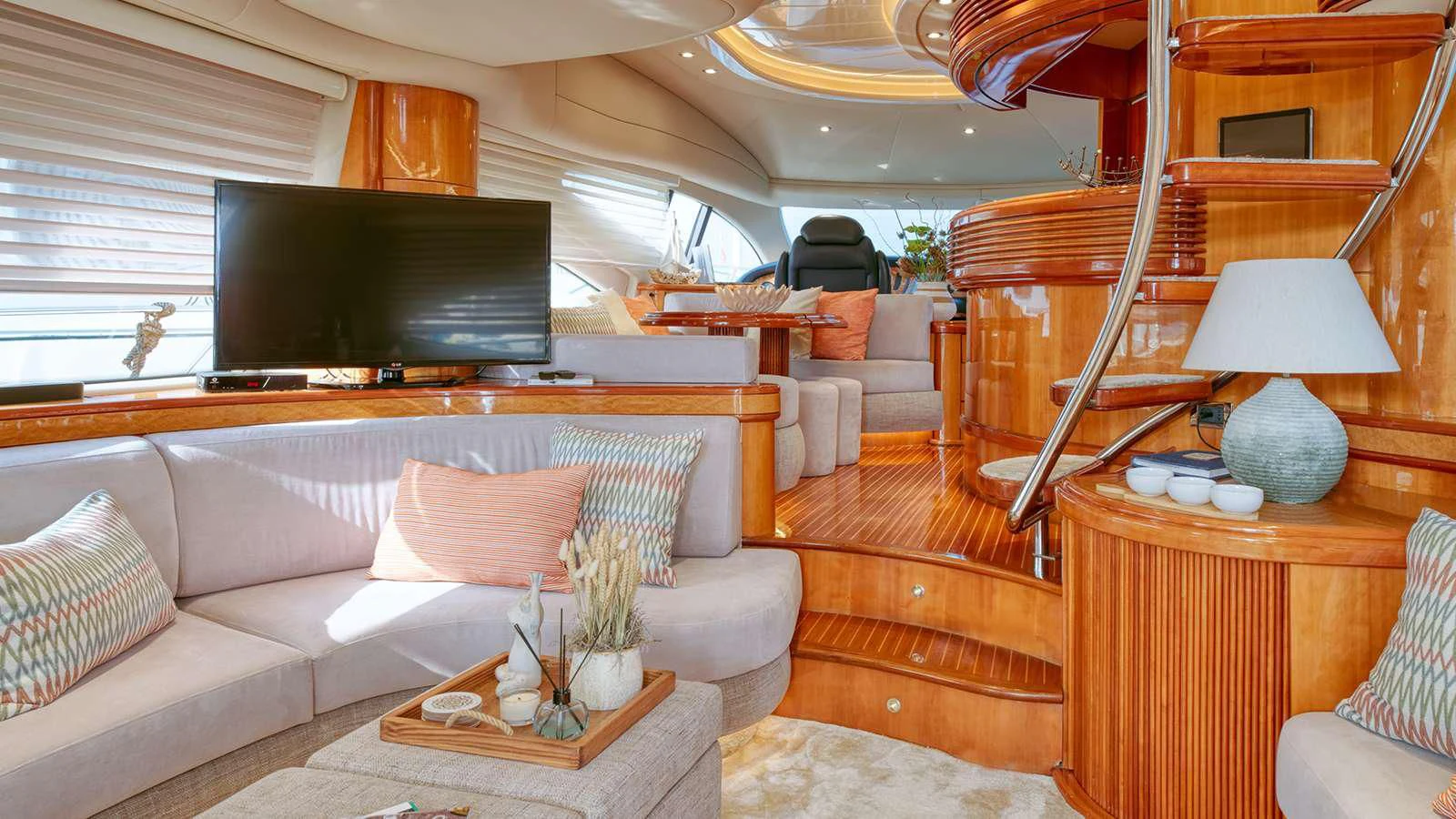 a living room with a large television aboard MANU Yacht for Charter