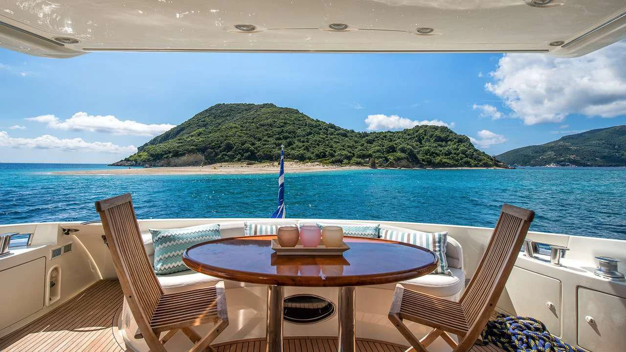 a table and chairs on a boat aboard MANU Yacht for Charter