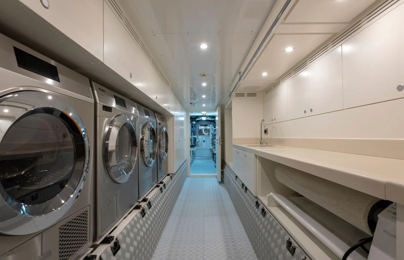 a long hallway with a large mirror aboard MYKO Yacht for Sale
