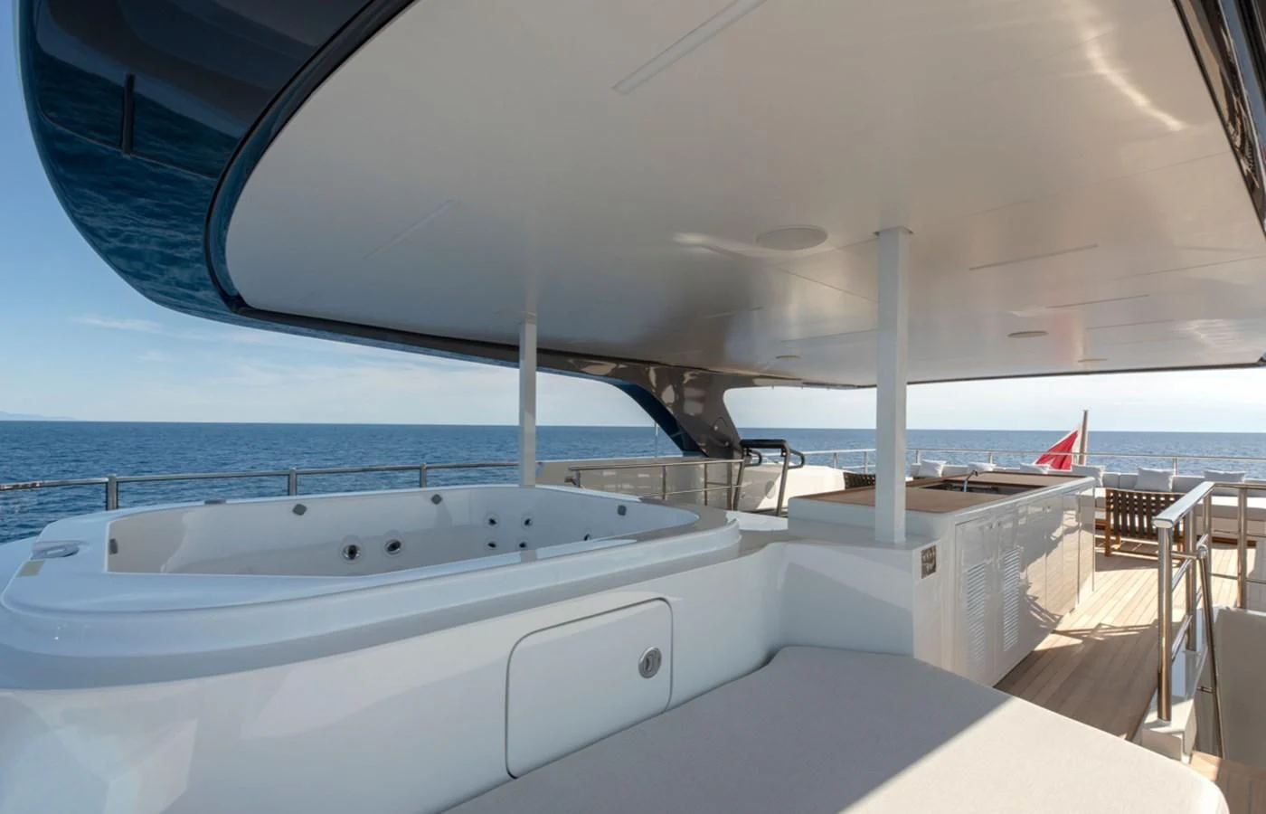 a large white boat on a large body of water aboard MYKO Yacht for Sale