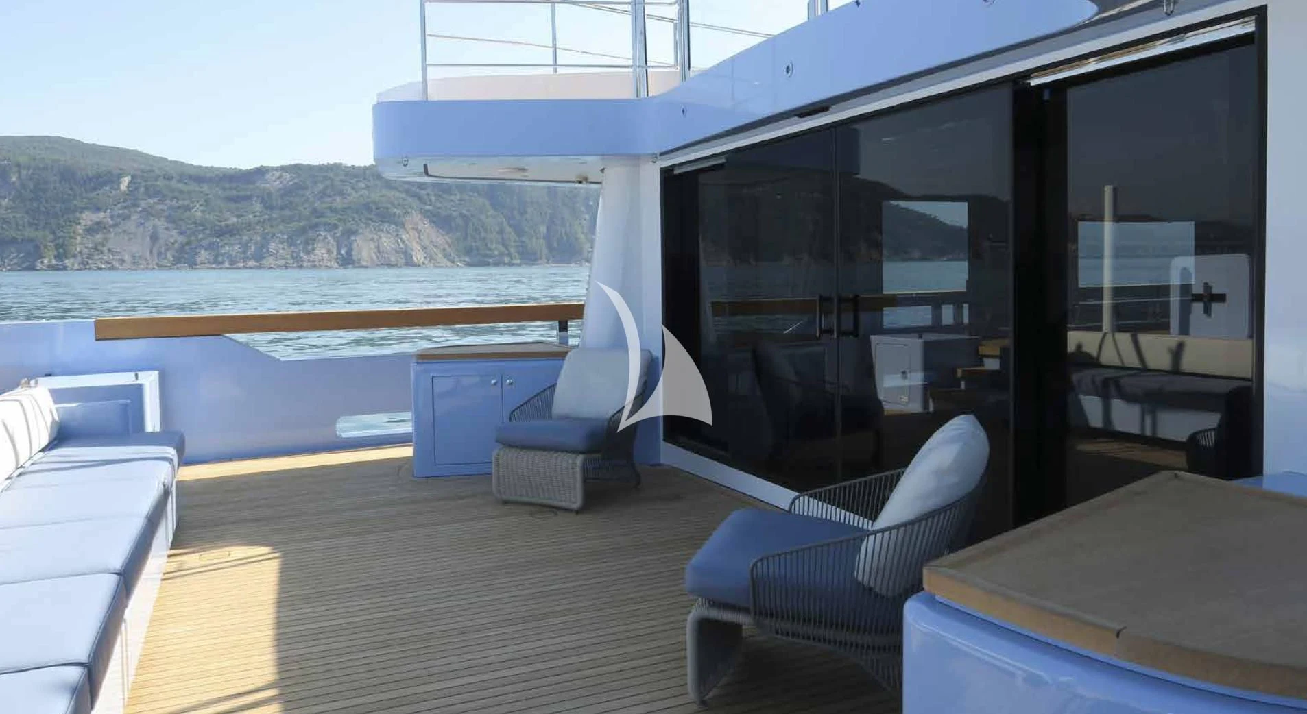 a room with a large window and a view of the ocean aboard MYKO Yacht for Sale