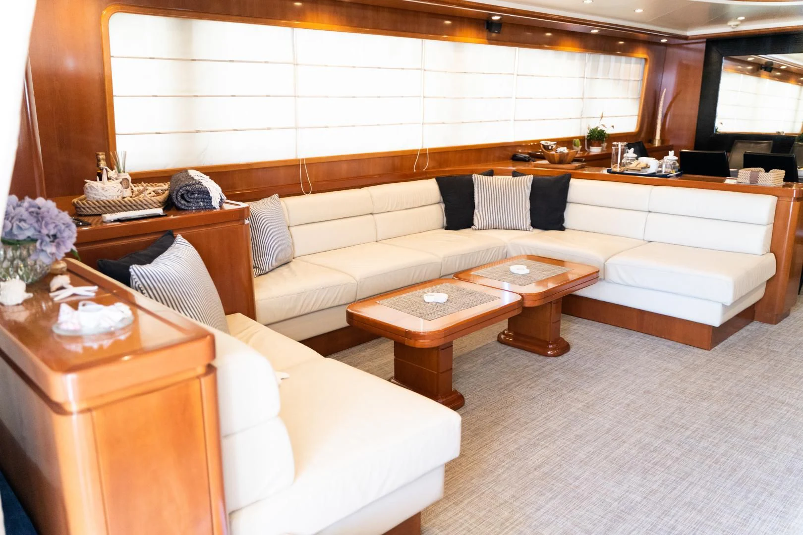 a living room with a couch and coffee table aboard ALPINN Yacht for Sale