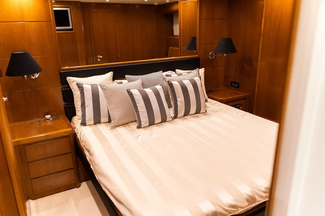 a bed with white sheets and pillows aboard ALPINN Yacht for Sale