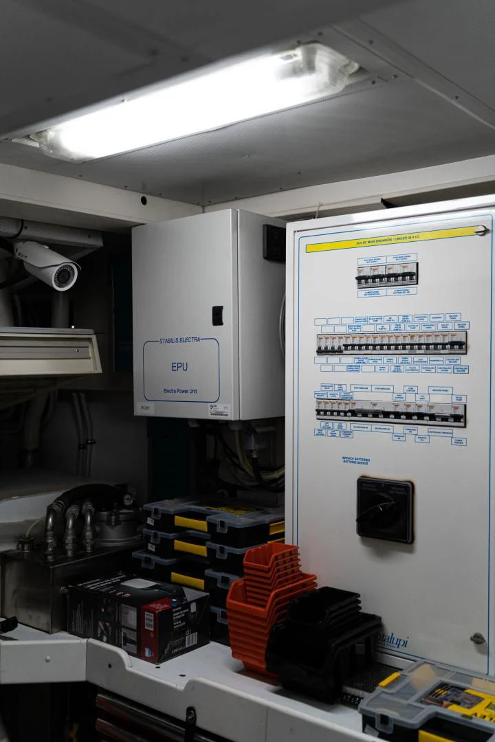 a white machine with a yellow and blue label on it aboard ALPINN Yacht for Sale