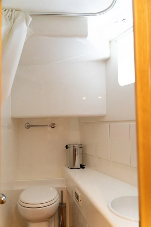 a bathroom with a toilet and sink aboard ALPINN Yacht for Sale