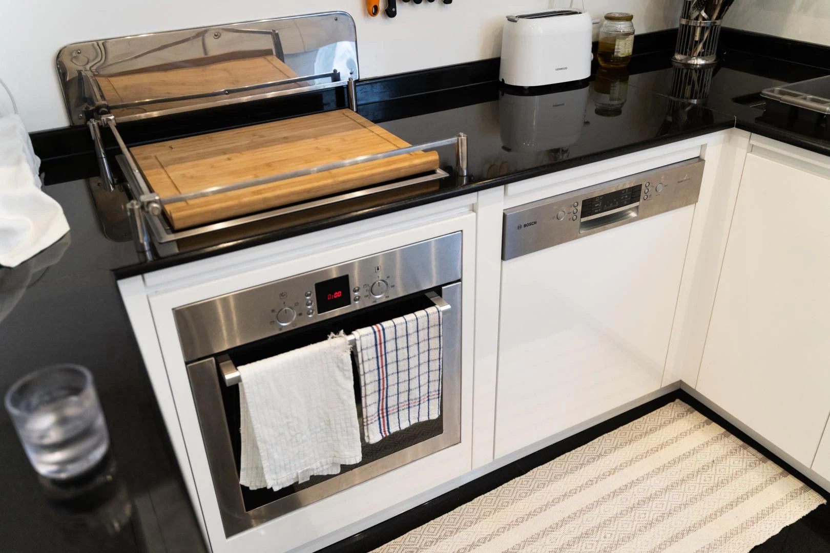 a kitchen with a stove and oven aboard ALPINN Yacht for Sale