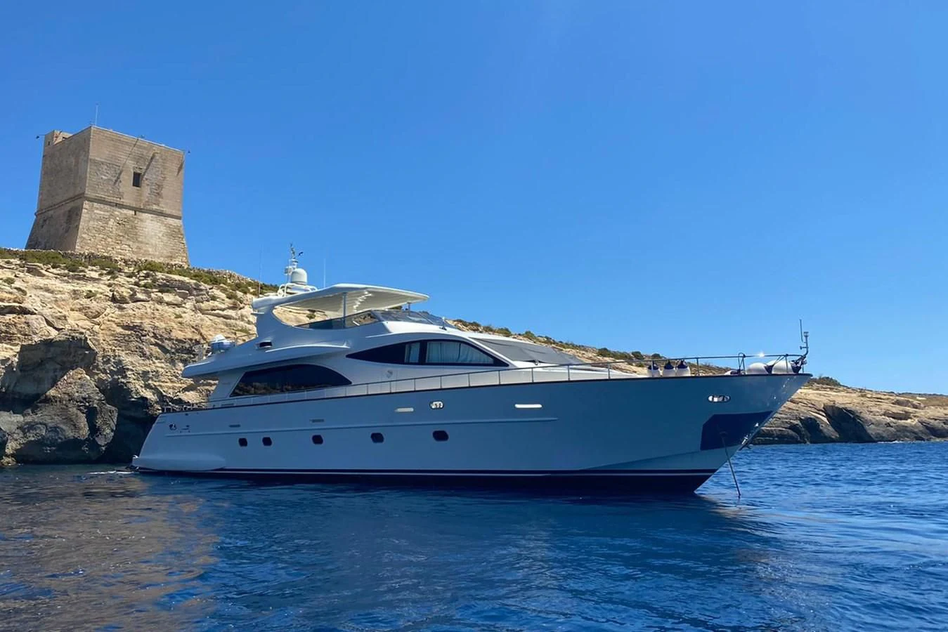 a white yacht in the water aboard ALPINN Yacht for Sale