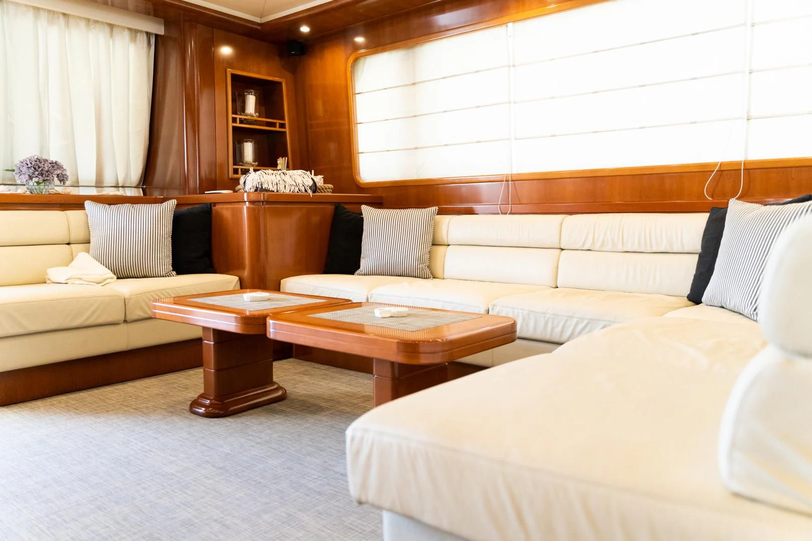 a room with a bed and a coffee table aboard ALPINN Yacht for Sale