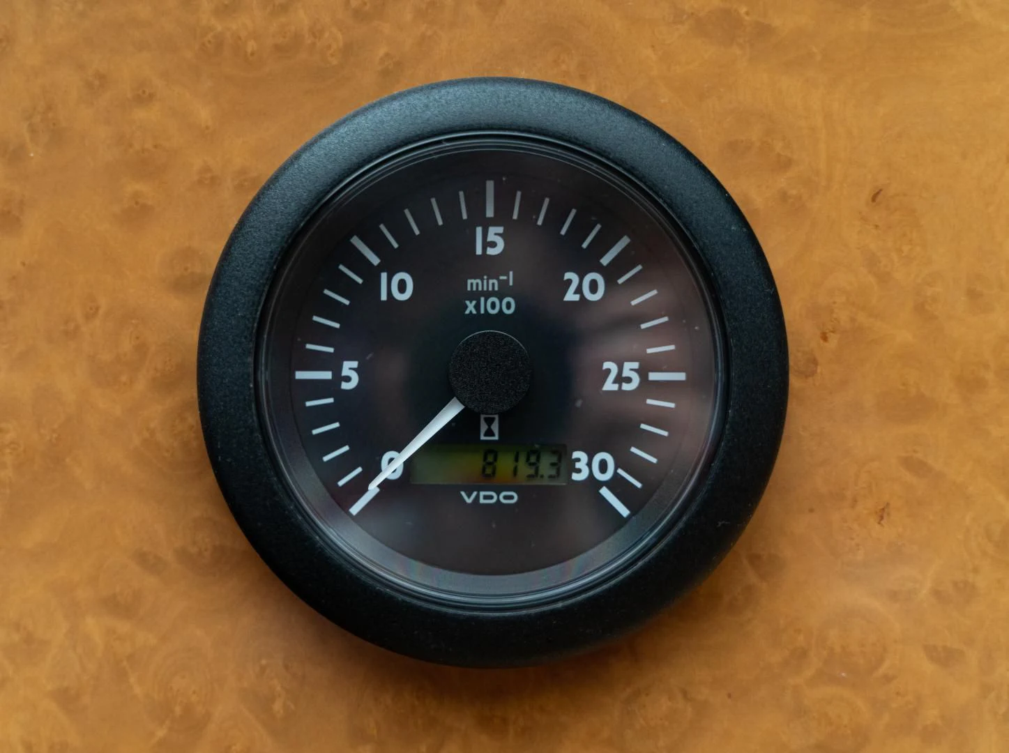 a black and gold analog clock aboard ALPINN Yacht for Sale