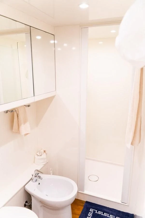 a bathroom with a sink and towels aboard ALPINN Yacht for Sale