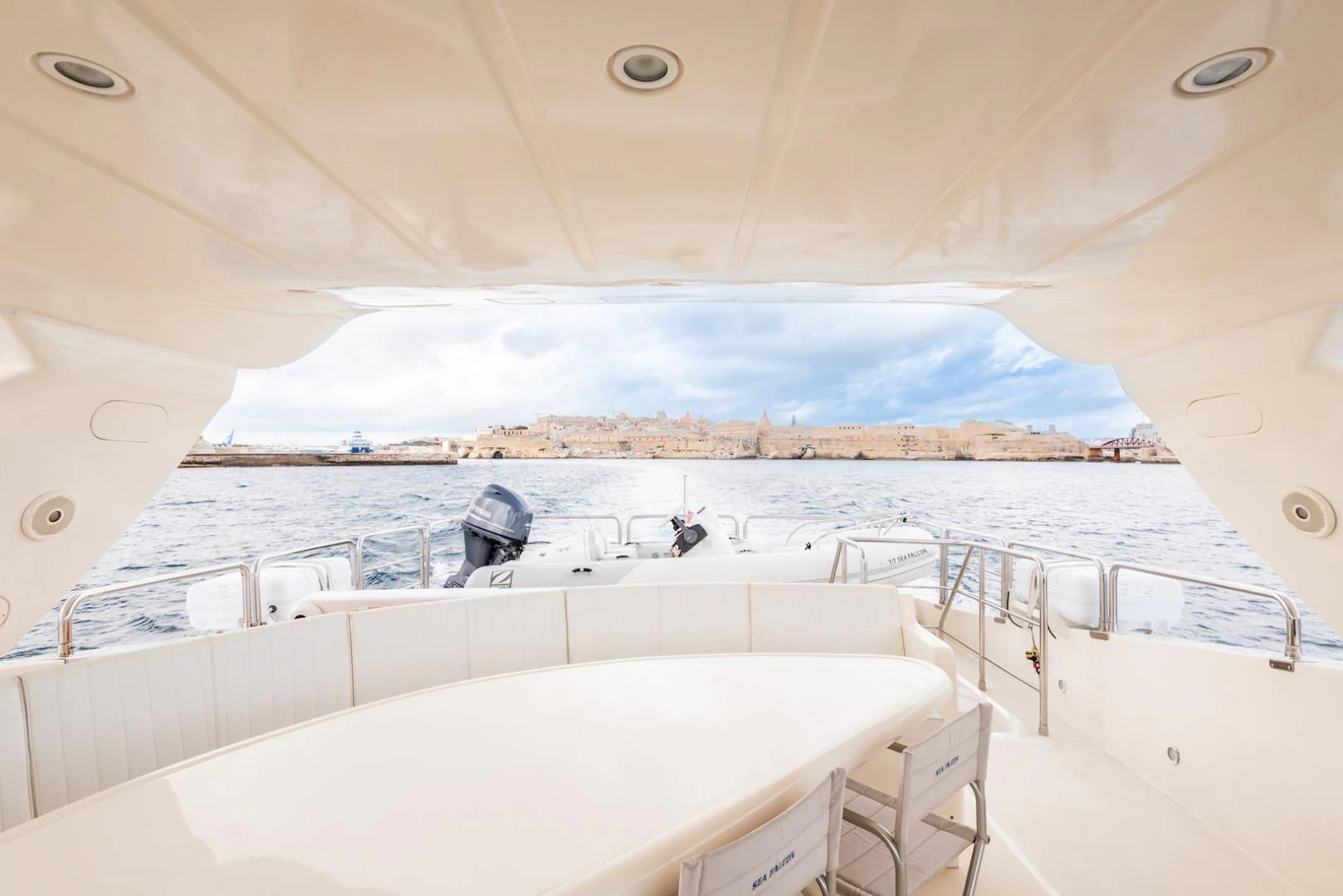 a large white boat with a large white pool in the background aboard ALPINN Yacht for Sale