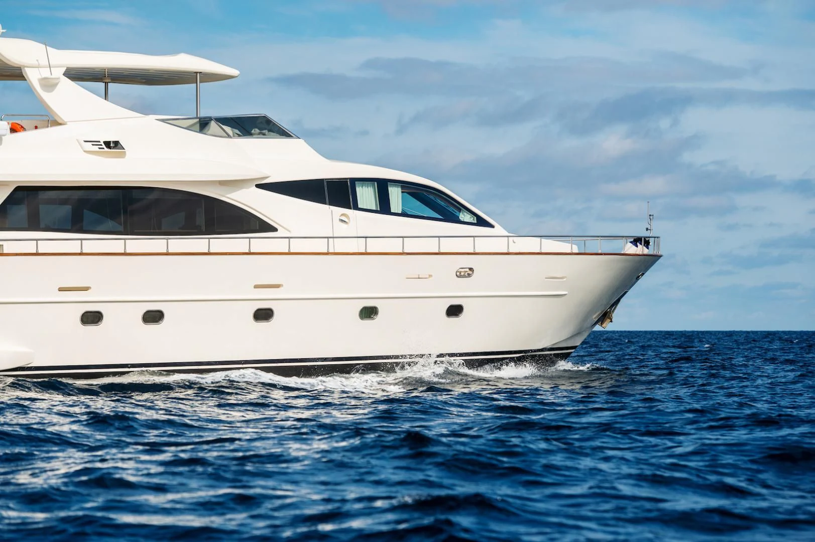 a white yacht in the water aboard ALPINN Yacht for Sale