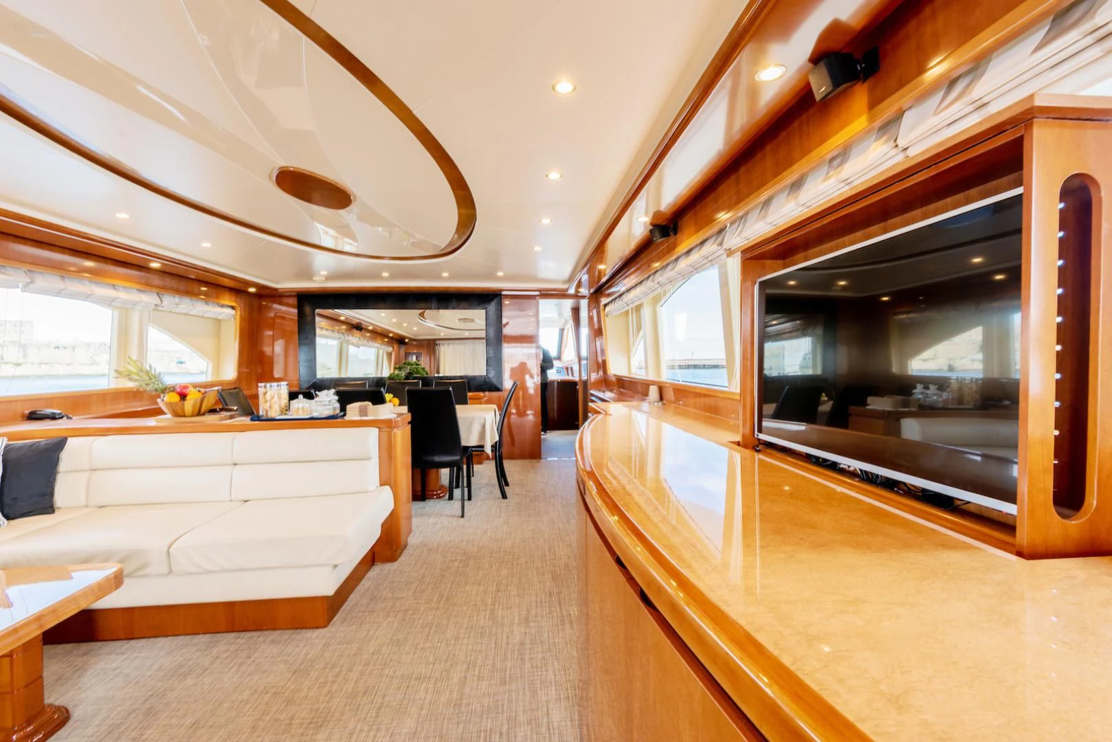 a room with a couch and a tv aboard ALPINN Yacht for Sale