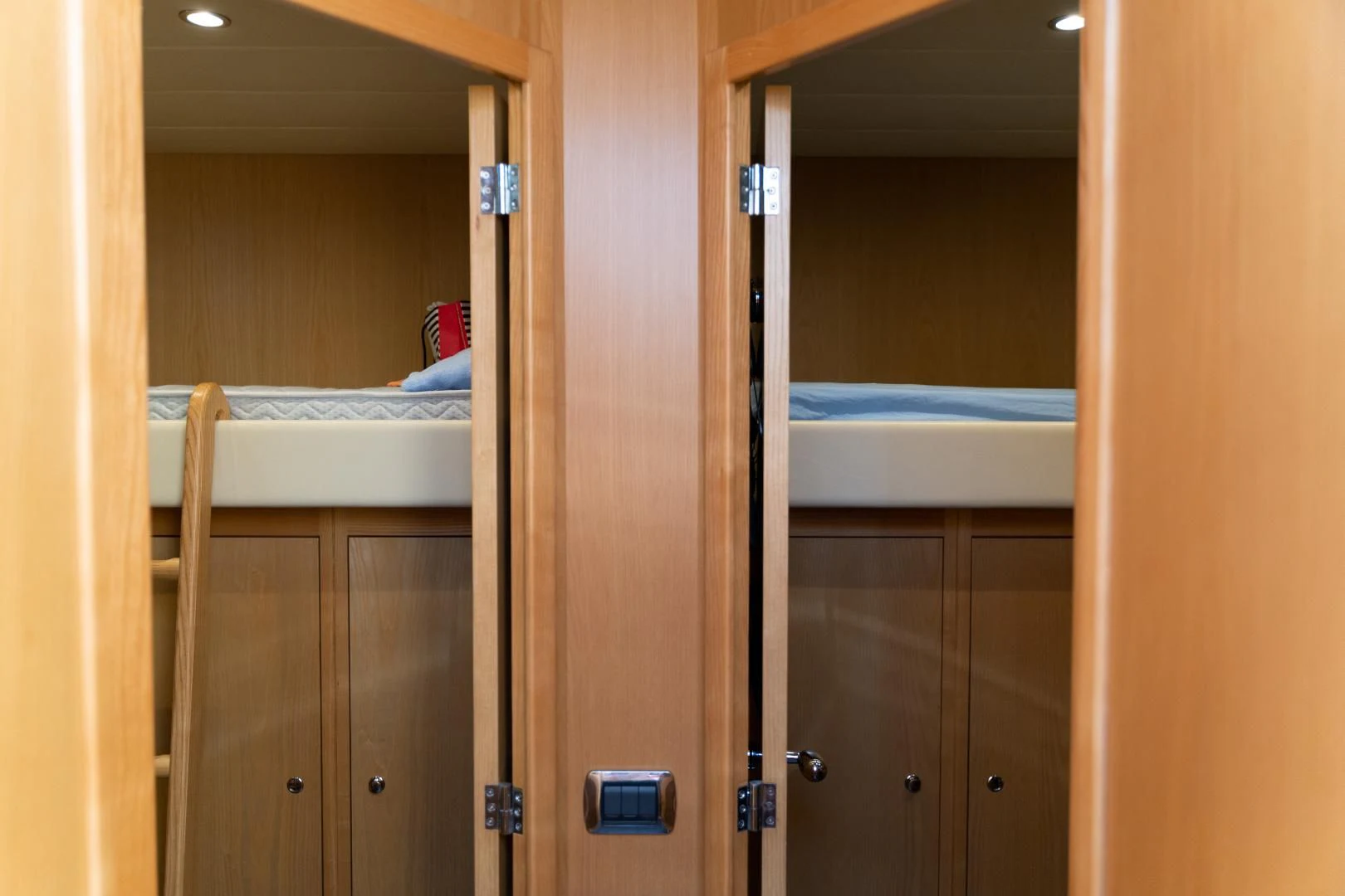 a room with a bed and a closet aboard ALPINN Yacht for Sale