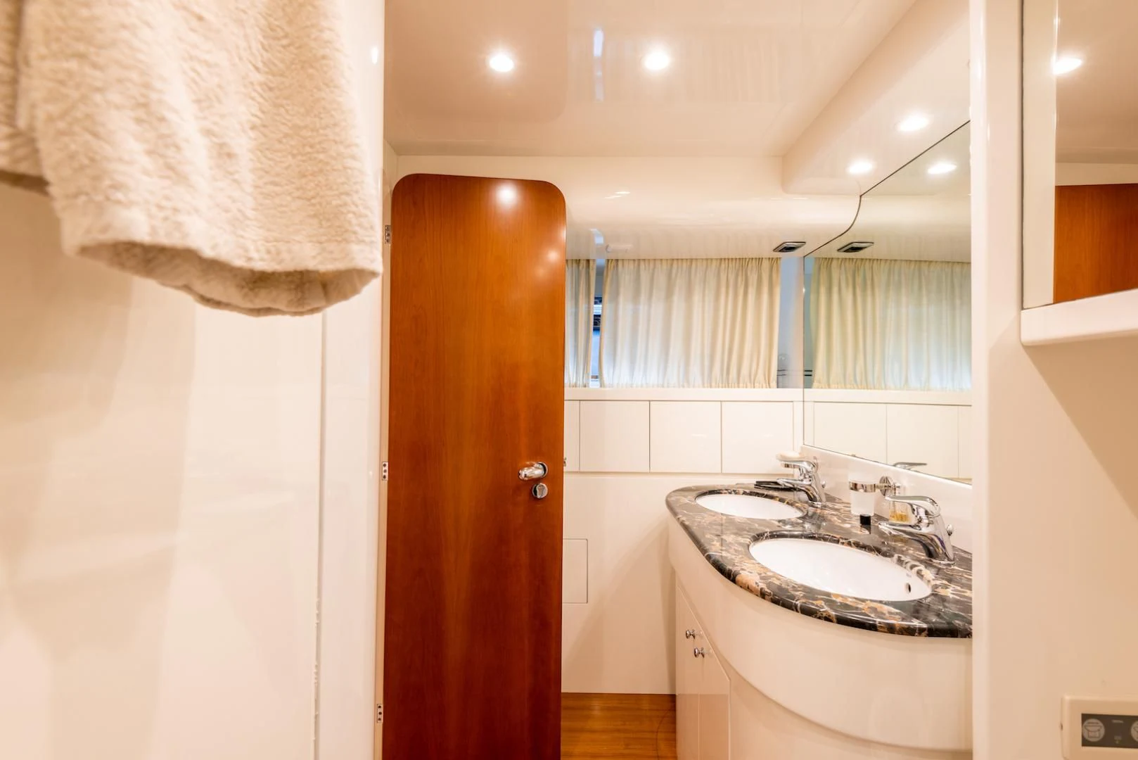 a bathroom with a sink and a mirror aboard ALPINN Yacht for Sale