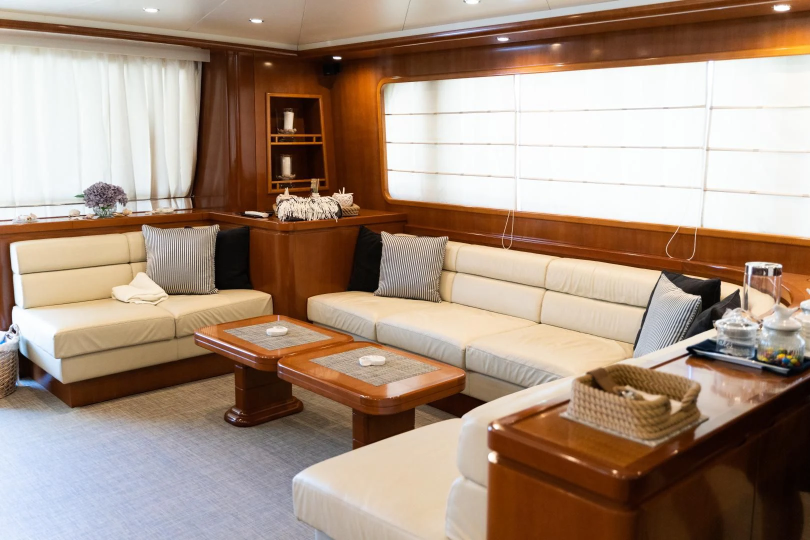 a living room with a couch and coffee table aboard ALPINN Yacht for Sale