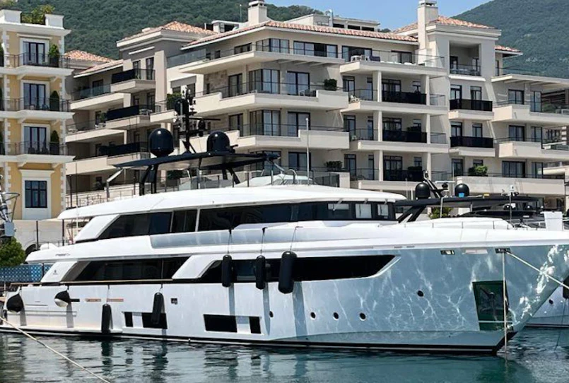 a white boat in front of a building aboard ALEX Yacht for Sale