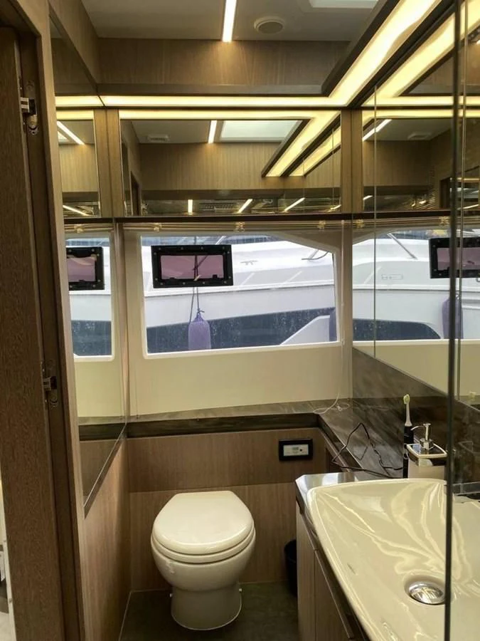 a bathroom with a large window aboard GALEON 640 Yacht for Sale