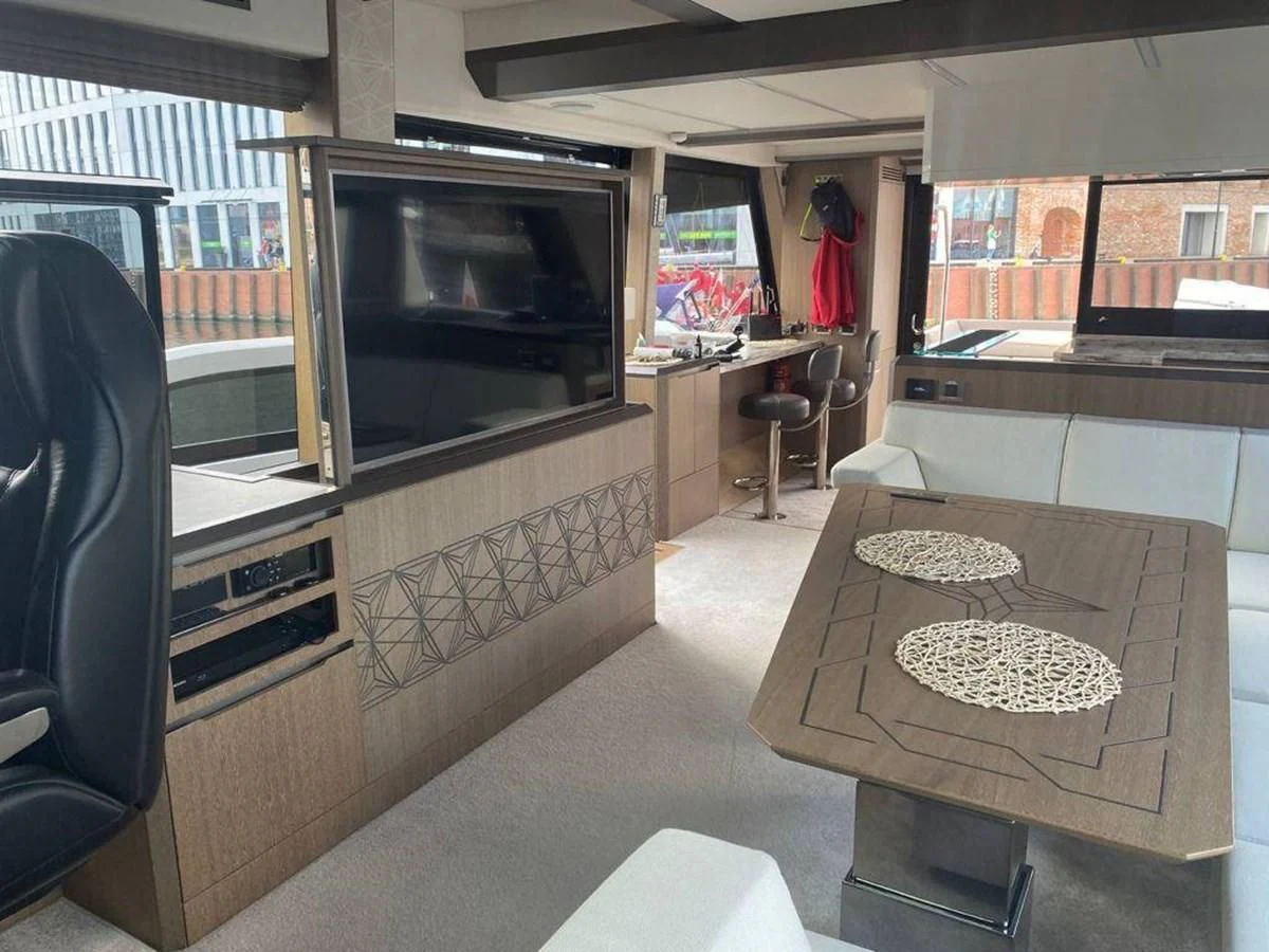 a room with a fireplace aboard GALEON 640 Yacht for Sale