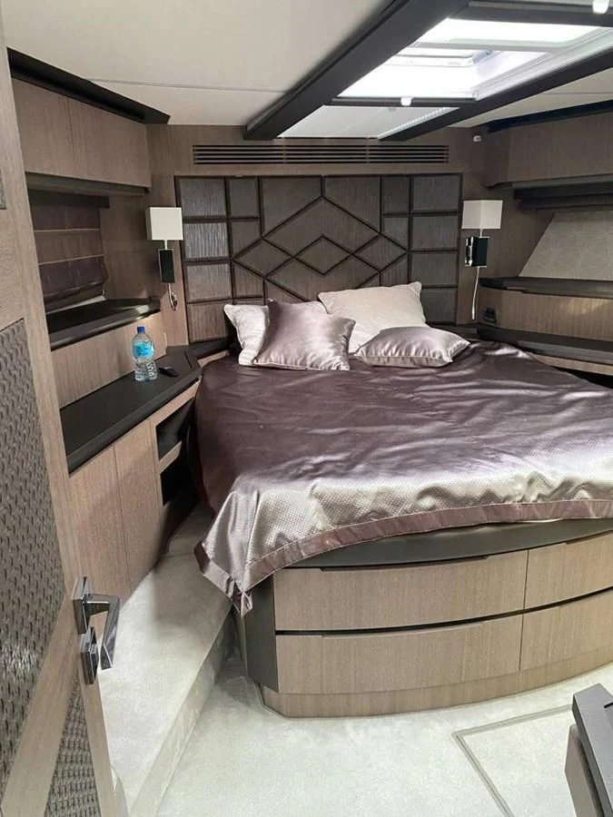 a bed with a brown blanket aboard GALEON 640 Yacht for Sale