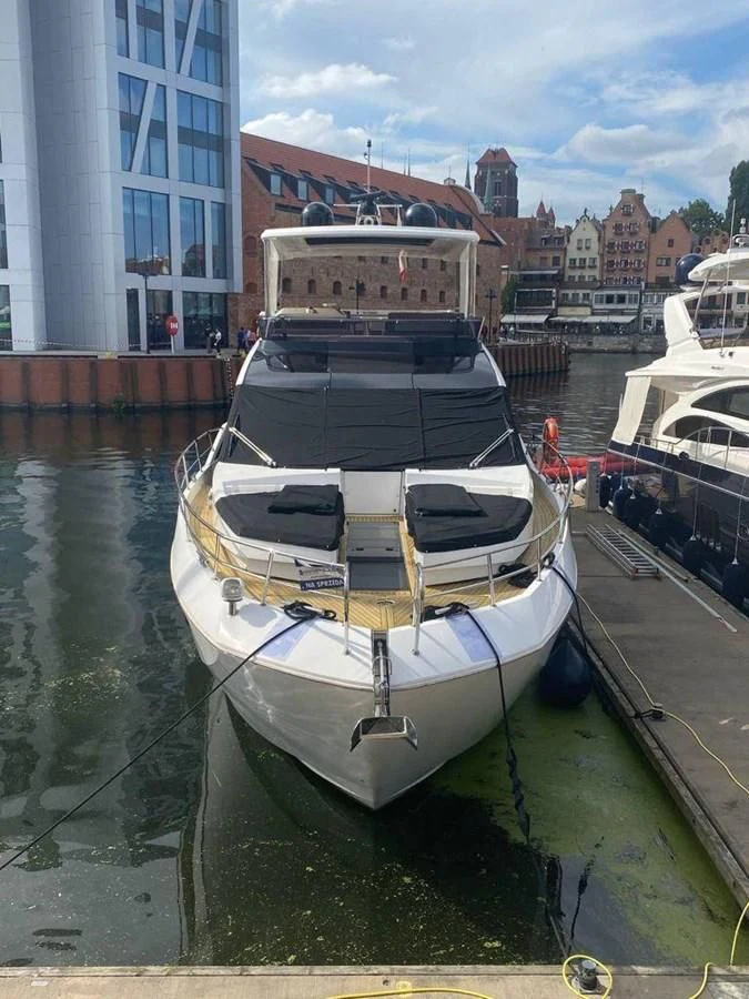 a boat docked at a pier aboard GALEON 640 Yacht for Sale