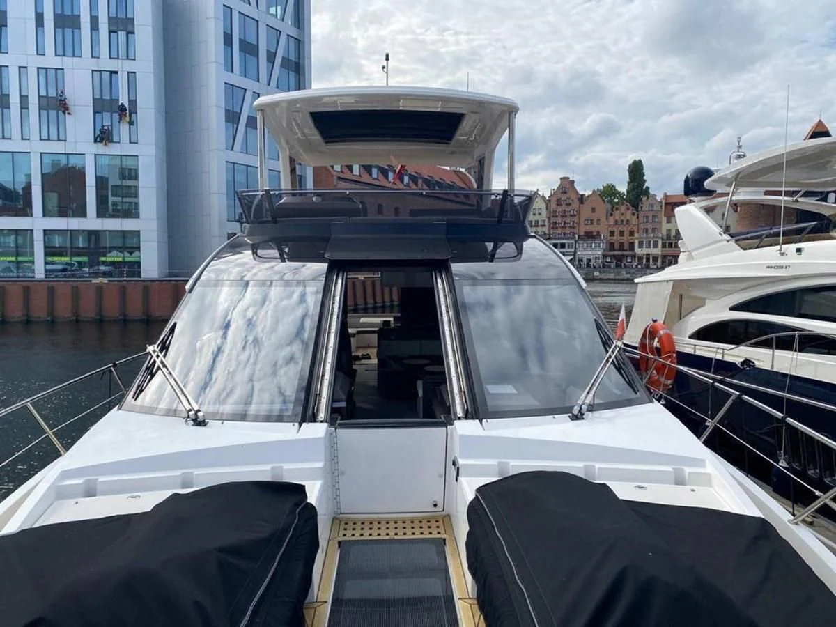 a group of boats are parked in a harbor aboard GALEON 640 Yacht for Sale