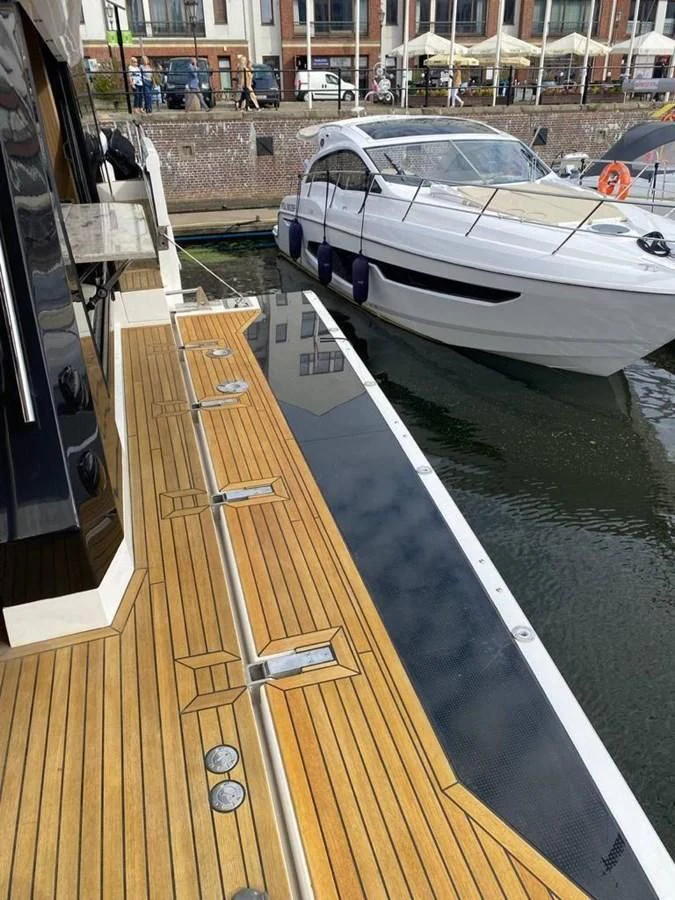 a car on a road aboard GALEON 640 Yacht for Sale