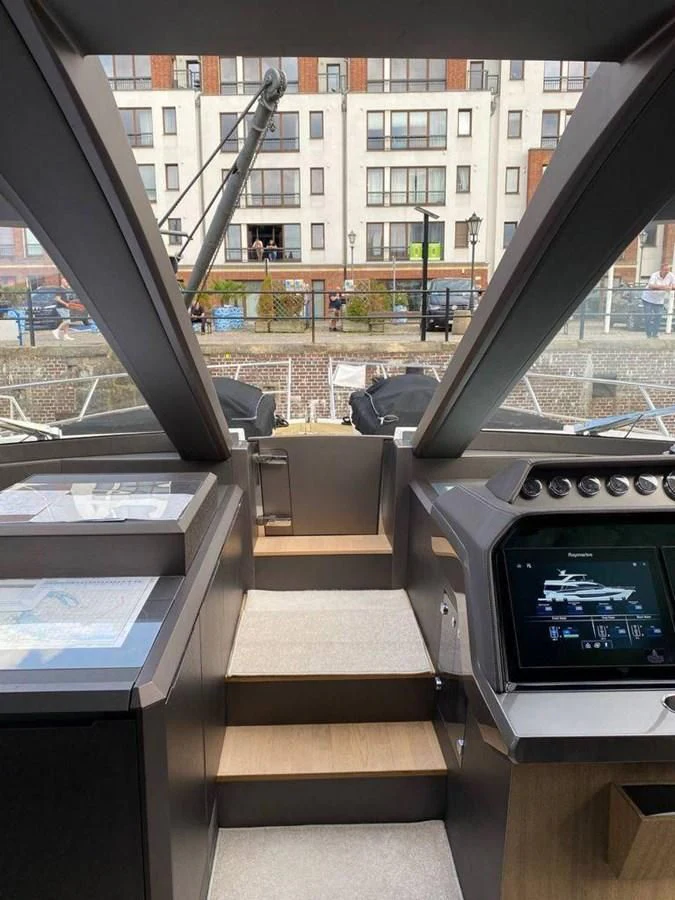 a room with a table and a window aboard GALEON 640 Yacht for Sale