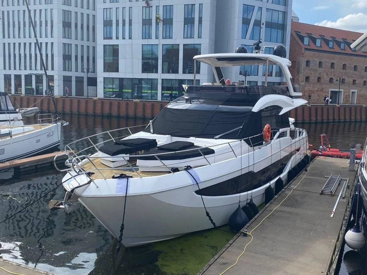 a boat docked at a pier aboard GALEON 640 Yacht for Sale