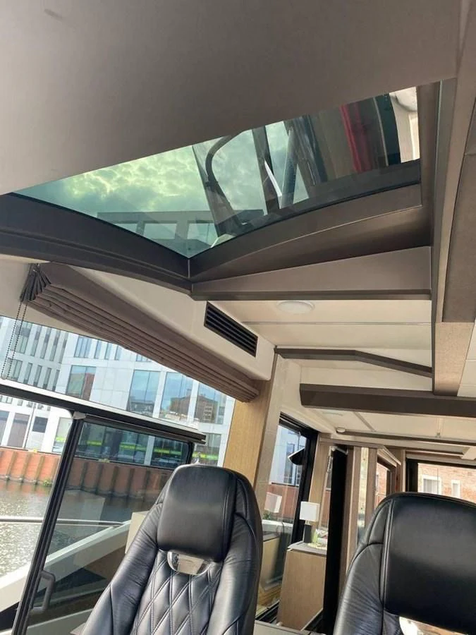 a glass wall with a green light aboard GALEON 640 Yacht for Sale