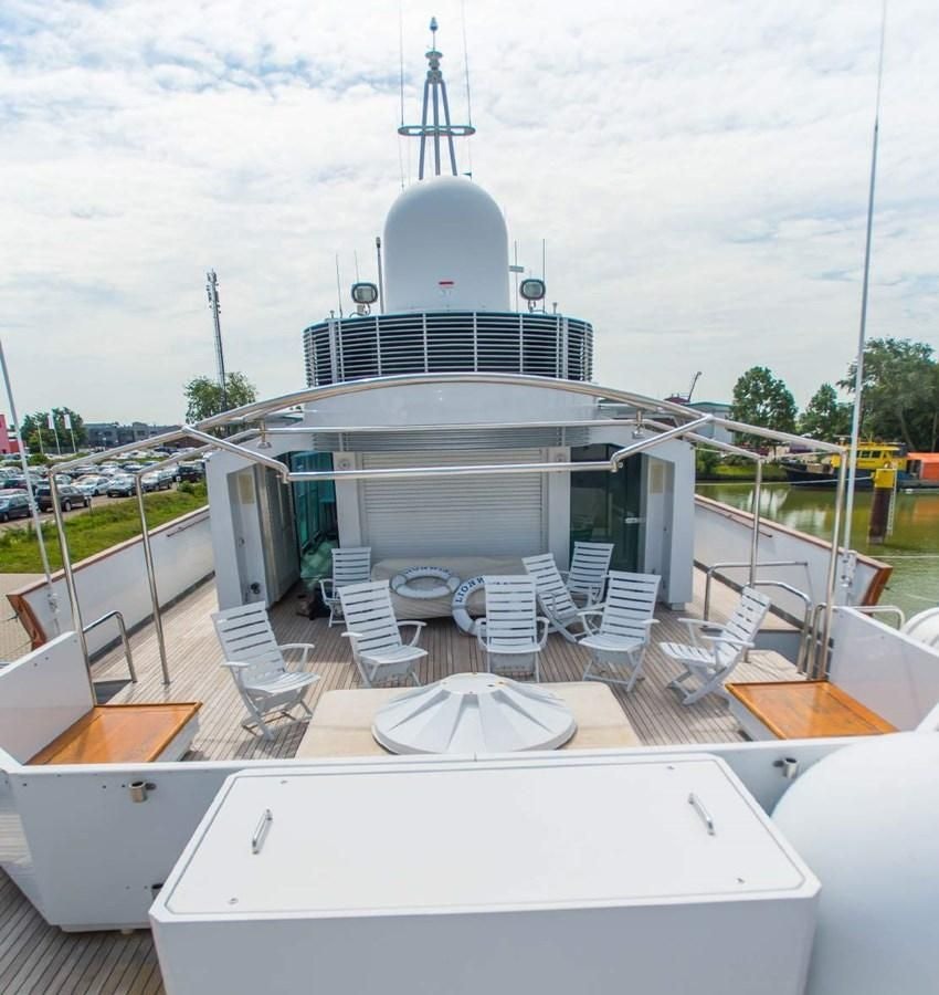 a building with a group of chairs outside aboard KORU Yacht for Charter