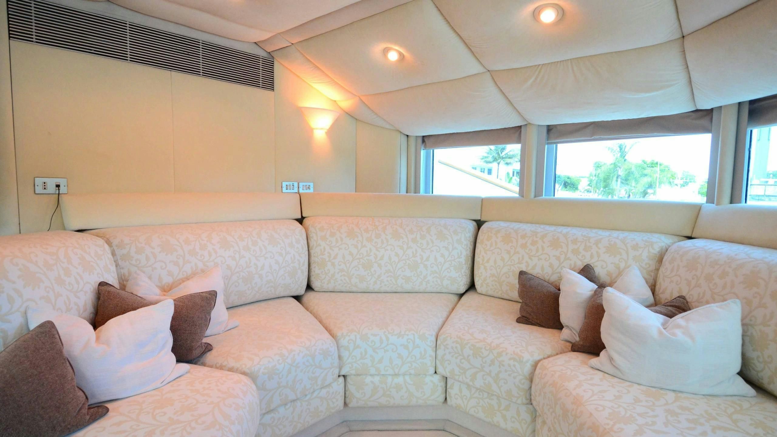 a couch in a room aboard KORU Yacht for Charter