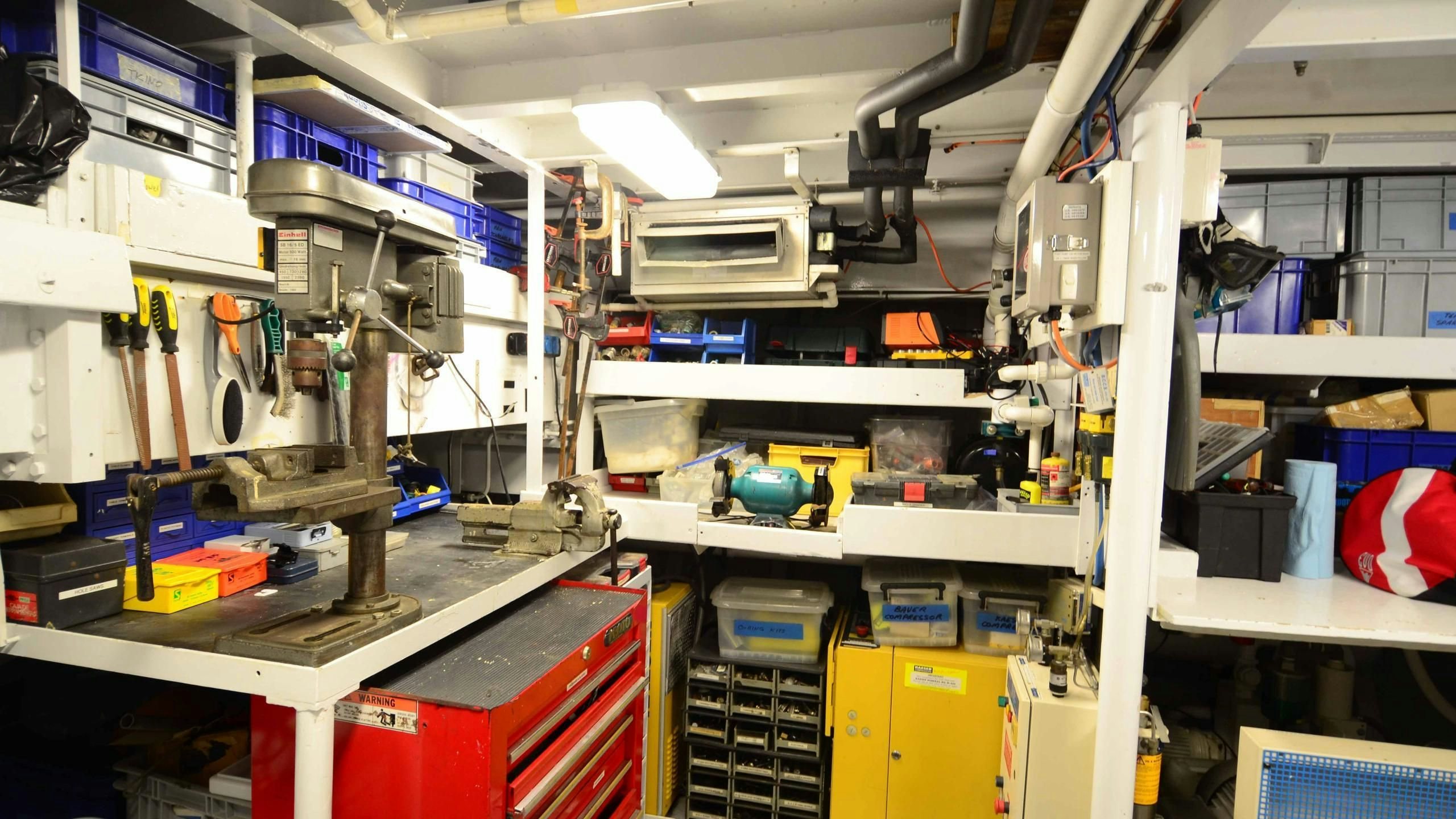 a room with shelves and equipment aboard KORU Yacht for Charter