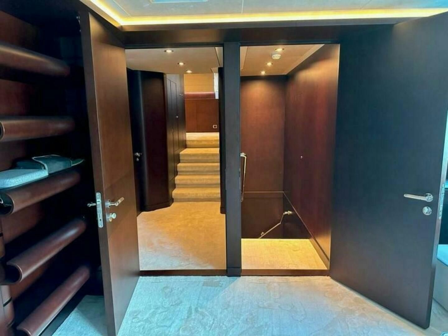 a hallway with doors aboard KORU Yacht for Charter