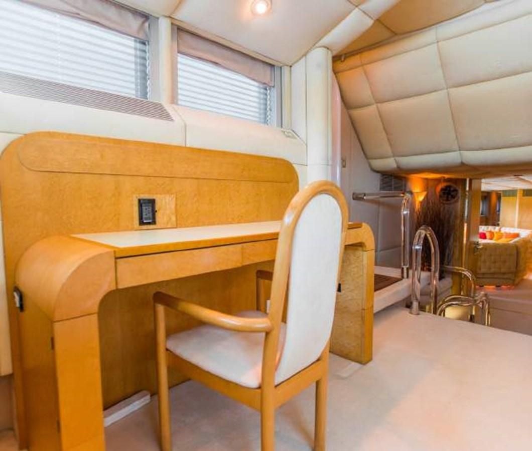 a wooden chair in a room aboard KORU Yacht for Charter