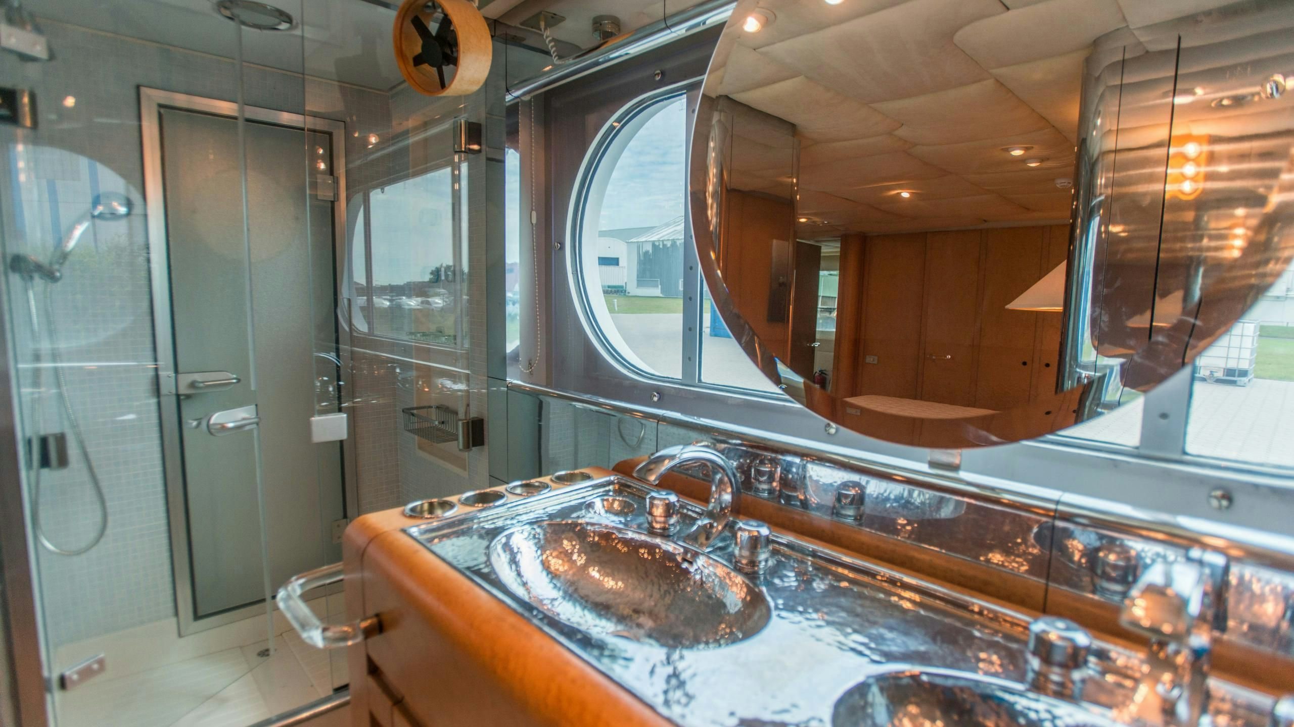 a bathroom with a large mirror aboard KORU Yacht for Charter