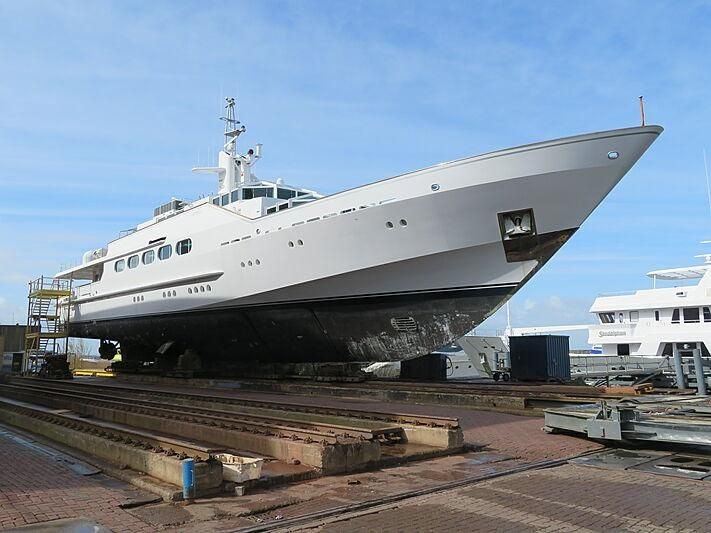 a large ship docked aboard KORU Yacht for Charter
